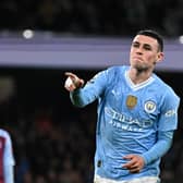 Manchester City's Phil Foden celebrates after scoring his team third goal against Aston Villa.