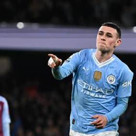 Manchester City's Phil Foden celebrates after scoring his team third goal against Aston Villa.