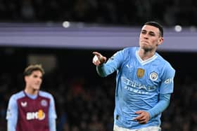 Manchester City's Phil Foden celebrates after scoring his team third goal against Aston Villa.