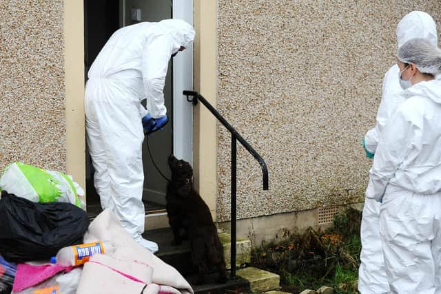 Final instructions being issued before cadaver dog begins searching the property in relation to the death of Ean Coutts