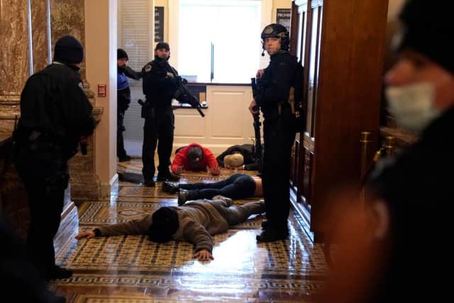 US Capitol Police detain protesters outside of the House Chamber (Photo: Drew Angerer/Getty Images)