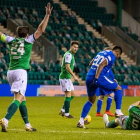 Alfredo Morelos stamps on Ryan Porteous during the first half of the Hibs-Rangers match on Wednesday