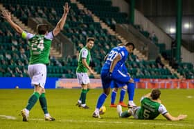 Alfredo Morelos stamps on Ryan Porteous during the first half of the Hibs-Rangers match on Wednesday