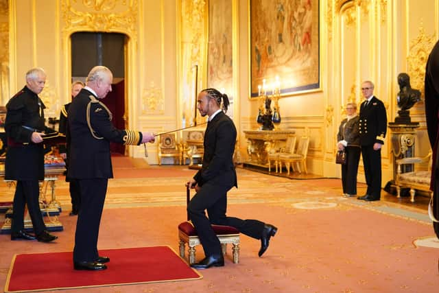 Sir Lewis Hamilton is made a Knight Bachelor by the Prince of Wales at Windsor Castle. Hamilton has been knighted in recognition of a glittering career in Formula One