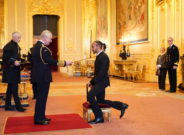 Sir Lewis Hamilton is made a Knight Bachelor by the Prince of Wales at Windsor Castle. Hamilton has been knighted in recognition of a glittering career in Formula One