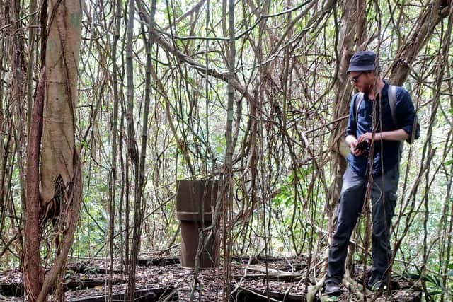 Michael Hopcroft inspects the equipment once used at the plantation's sugar factory.