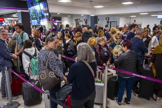 Passengers at Edinburgh Airport on Tuesday. (Photo by Lisa Ferguson)