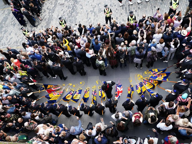 Members of the public during an Accession Proclamation Ceremony at Mercat Cross, Edinburgh, publicly proclaiming King Charles III as the new monarch. Picture date: Sunday September 11, 2022.