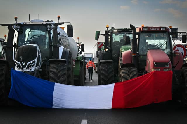 Farmers block the A7 motorway near Albon, south-east France, amid protests across both the country and Europe over what they regard as excessive charges and environmental protection rules (Picture: Olivier Chassignole/AFP via Getty Images