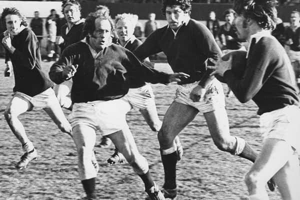 Dave Firth prepares to tackle Hawick’s Ken McCartney in a Border League game