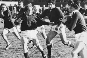 Dave Firth prepares to tackle Hawick’s Ken McCartney in a Border League game