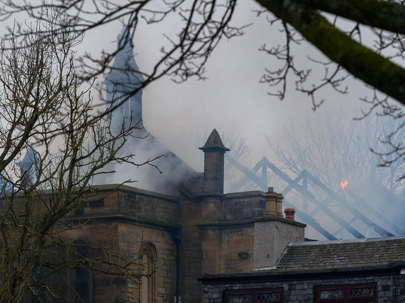 The damage to the roof of the church can be seen.