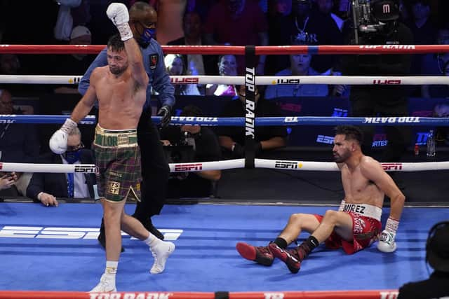 Josh Taylor walks away after knocking down Jose Ramirez