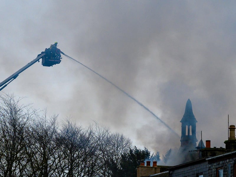 The aerial platform is used to help douse the fire.