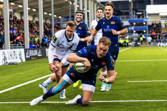 Edinburgh's Duhan van der Merwe scores his second try during the win over Castres in the EPCR Challenge Cup at Hive Stadium as team-mates Darcy Graham and Wes Goosen look on.  (Photo by Ross Parker / SNS Group)