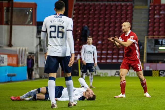 Aberdeen's Curtis Main is yellow carded for a foul on Rangers' Borna Barisic during a Scottish Premiership match between Aberdeen and Rangers at Pittodrie, on January 10, 2021, in Aberdeen, Scotland. (Photo by Craig Williamson / SNS Group)