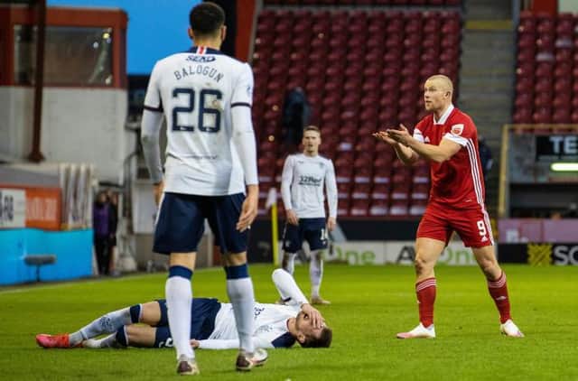 Aberdeen's Curtis Main is yellow carded for a foul on Rangers' Borna Barisic during a Scottish Premiership match between Aberdeen and Rangers at Pittodrie, on January 10, 2021, in Aberdeen, Scotland. (Photo by Craig Williamson / SNS Group)