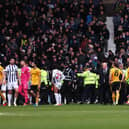 Stewards and police officers attempt to stop a pitch invasion during the Emirates FA Cup Fourth Round match between West Bromwich Albion and Wolverhampton Wanderers at The Hawthorns. (Photo by Jack Thomas - WWFC/Wolves via Getty Images)