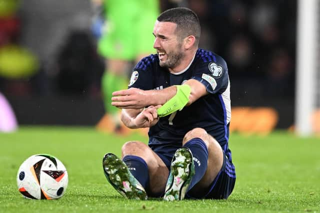 Scotland's John McGinn goes off injured during last Sunday's match against Norway.