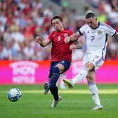 Scotland's John McGinn (right) has a shot at goal under pressure from Norway's Patrick Berg during Saturday's 2-1 win in Oslo. Pic: Zac Goodwin/PA Wire.