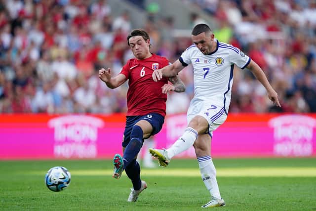 Scotland's John McGinn (right) has a shot at goal under pressure from Norway's Patrick Berg during Saturday's 2-1 win in Oslo. Pic: Zac Goodwin/PA Wire.