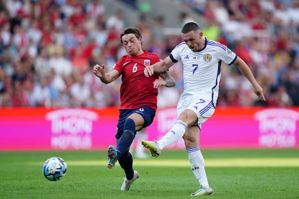 Scotland's John McGinn (right) has a shot at goal under pressure from Norway's Patrick Berg during Saturday's 2-1 win in Oslo. Pic: Zac Goodwin/PA Wire.