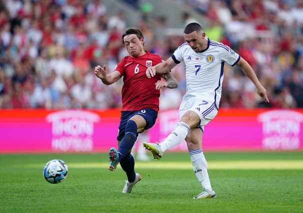 Scotland's John McGinn (right) has a shot at goal under pressure from Norway's Patrick Berg during Saturday's 2-1 win in Oslo. Pic: Zac Goodwin/PA Wire.