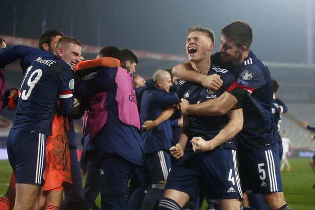 The Scotland team celebrates their first qualification for a major tournament in 22 years (Picture: Srdjan Stevanovic/Getty Images)