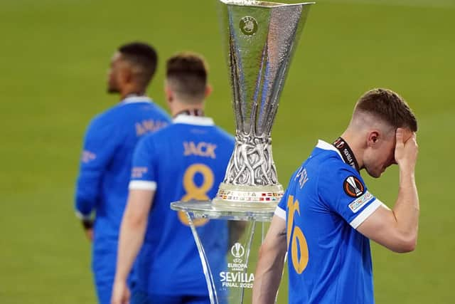 Rangers' Aaron Ramsey walks past the trophy following defeat in the UEFA Europa League final.