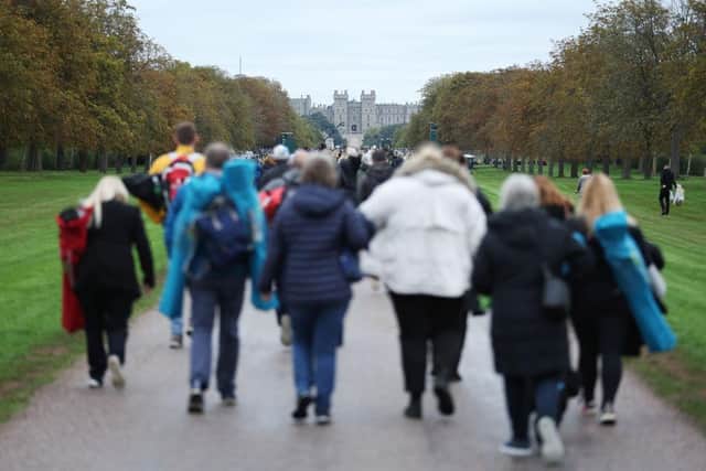 Mourners make their way towards Windsor Castle ahead of the committal service at St George's Chapel, Windsor Castle, following the Queen's state funeral at Westminster Abbey.