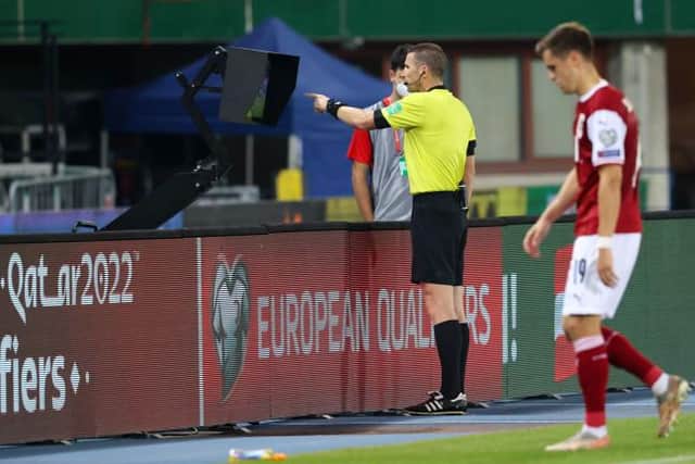 Referee Georgi Kabakov consults the VAR monitor during the FIFA World cup Qualifer between Austria and Scotland at the Ernst-Happel-Stadion, on September 07, 2021, in Vienna, Austria. (Photo by Alan Harvey / SNS Group)