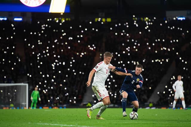 Callum McGregor and Andreas Cornelius battle under the twinkling lights of Hampden. (Photo by Craig Foy / SNS Group)