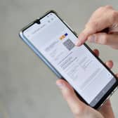 John McLellan has been having trouble with the Covid passport app on his smartphone (Picture: AFP via Getty Images)