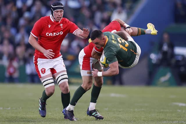South Africa centre Jesse Kriel feels the full force of Wales during the Boks' defeat in Bloemfontein. (Photo by PHILL MAGAKOE / AFP)