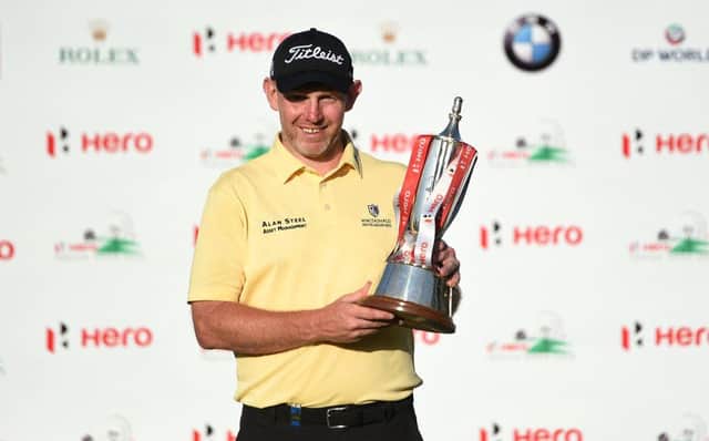 Stephen Gallacher holds his trophy after his most recent European Tour win in the 2019 Hero Indian Open in New Delhi. Picture: Money Sharma/AFP via Getty Images.