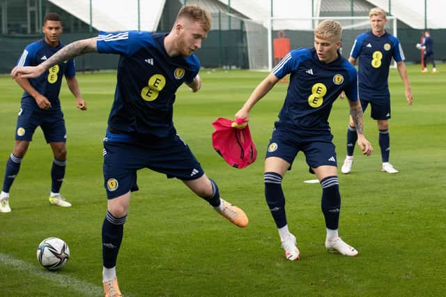 Ryan Duncan, right, battles for possession during a Scotland Under-21 training session.