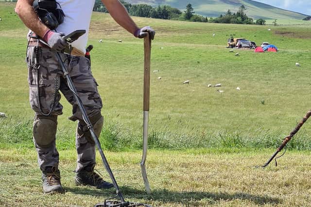 Metal detectorist Mariusz Stepien at the excavation site near Peebles where he found the horse harness and sword. PIC: Crown Office Communications/PA Wire