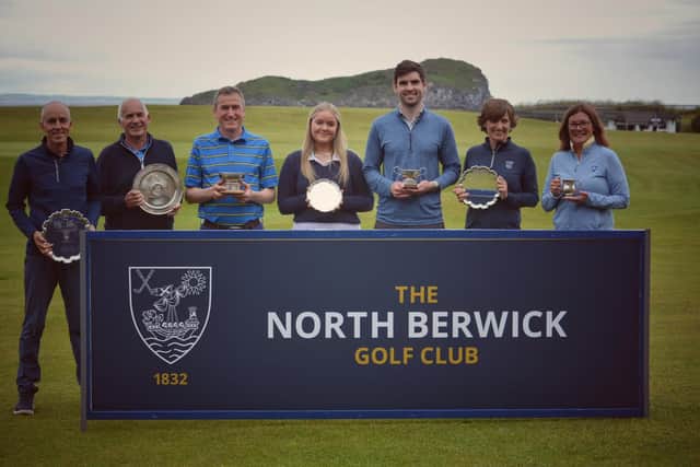 Mike Gray, third from the right, and Louise Martin, centre, show off their trophies along with the other championship winners at North Berwick.