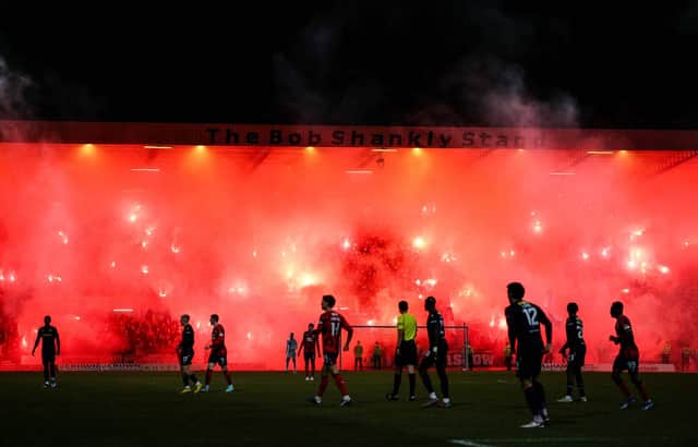 Rangers fans light up the Bob Shankly stand with flares before the match against Dundee was halted.  (Photo by Ross Parker / SNS Group)