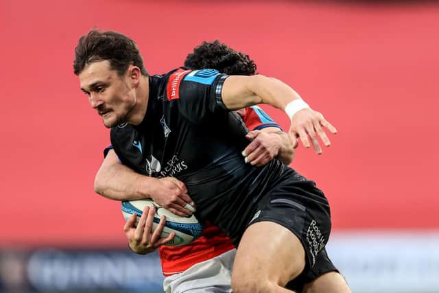 Munster's Paddy Patterson tackles Cole Forbes of Glasgow.