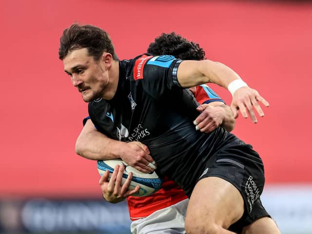 Munster's Paddy Patterson tackles Cole Forbes of Glasgow.