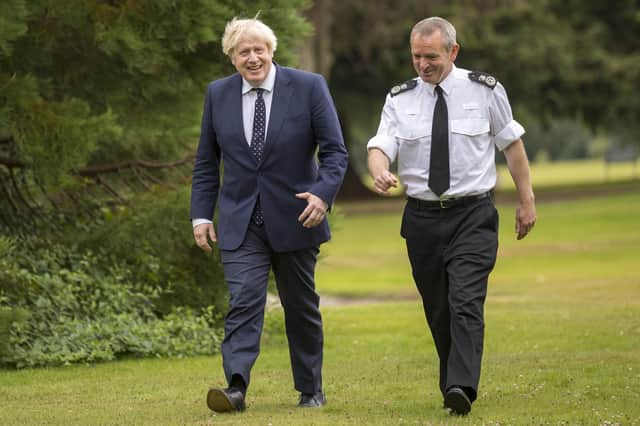 Prime Minister Boris Johnson with Chief Constable Iain Livingstone as he meets officers during a visit to the Scottish Police College at Tulliallan near Kincardine, Fife.