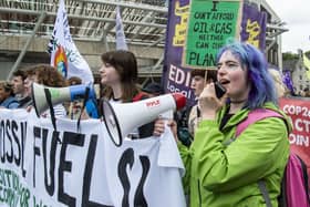 Climate change protesters stage a demonstration outside the Scottish Parliament on 16 September. Picture: Lisa Ferguson