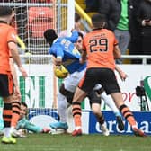 Rangers' Fashion Sakala has his shirt pulled in the box by Dundee United's Ross Graham during a Cinch Premiership match between Dundee United and Rangers at Tannadice.  (Photo by Rob Casey / SNS Group)