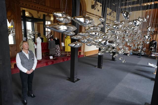 Assistant curator Sarah Hoare views the art installation The Salmon School, by artist Joseph Rossano, as it goes on display in the Castle Ballroom at Balmoral.
Pic: Andrew Milligan