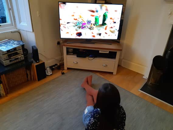 TV viewers in Scotland say they are least satisfied with their portrayal on BBC programmes. A child watches CBeebies animation Tiny Wonders, voiced by Scottish youngsters.