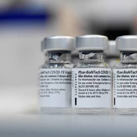 Empty vials of the Pfizer-BioNTech Covid-19 disease vaccine. Picture: Thomas Kienzle/AFP via Getty Images