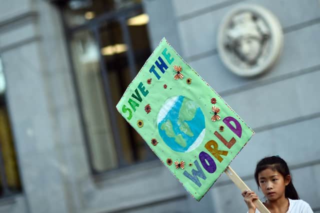 Young people, like this girl at a youth climate action strike in Madrid, are right to protest about the lack of action to deal with climate change (Picture: Oscar Del Pozo/AFP via Getty Images)