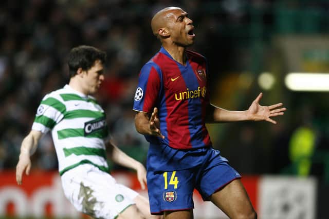 Barcelona's French forward Thierry Henry (R) reacts after a missed chance as his team challenge Celtic during their UEFA Cup Champions League football match at Celtic Park, Glasgow, Scotland, on February 20, 2008. (LLUIS GENE/AFP via Getty Images)