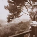 Lord Kelvin outside with notebook
